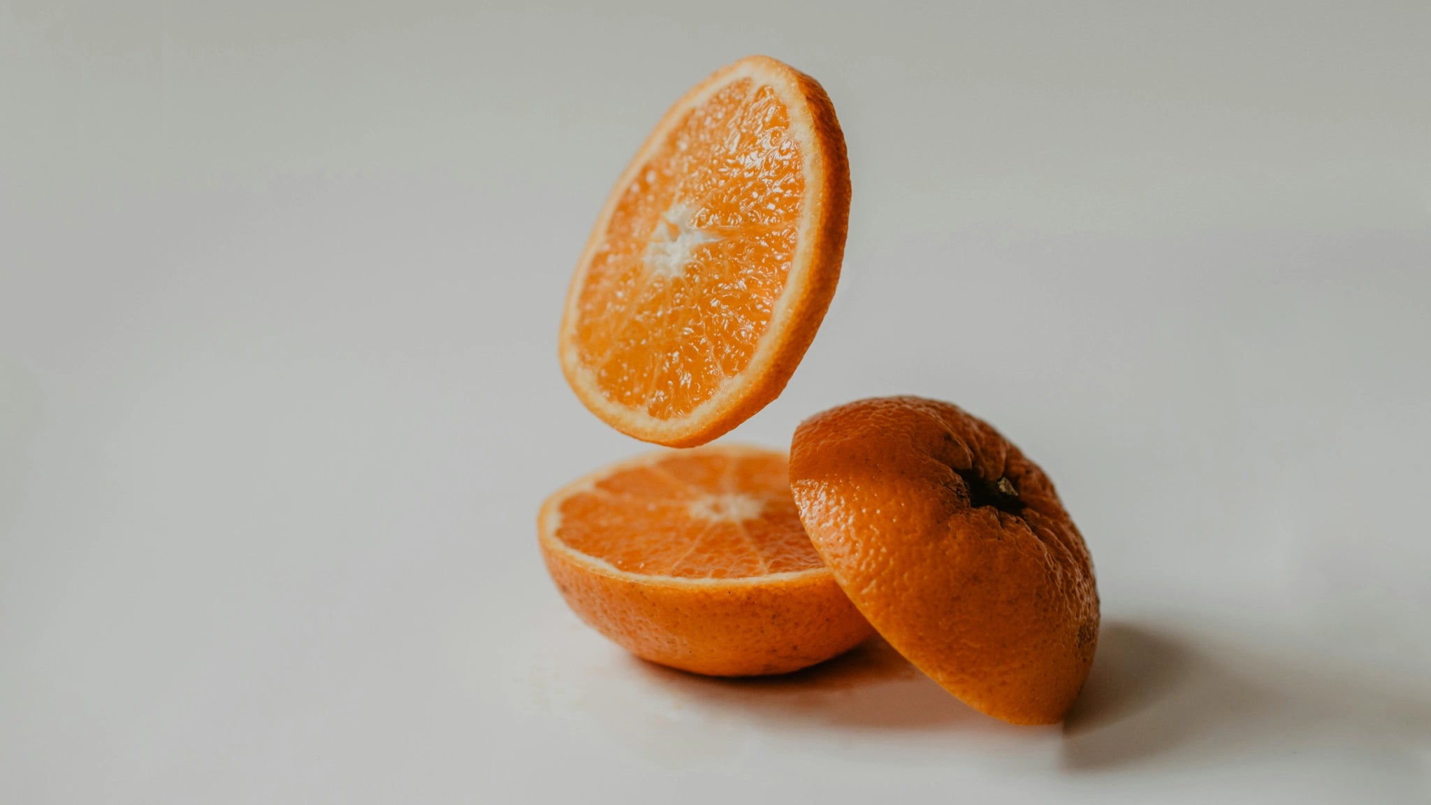 sliced oranges on surface